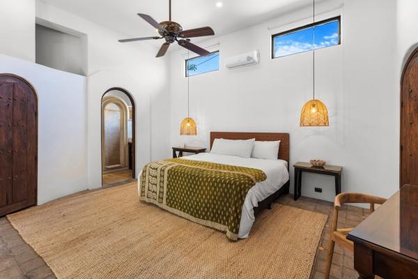 Bedroom 1 with king bed and pool view at Villa Antigua, a luxury Costa Rica villa rental on the ground floor