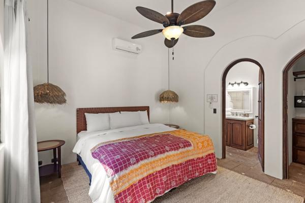 Bedroom 2 with queen bed and pool view at Villa Antigua, a private pool villa Costa Rica on the ground floor