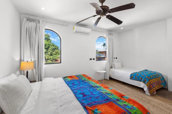Bedroom 6 with king bed in separate wing at Villa Antigua, a private pool villa Costa Rica