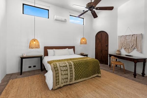 Pool-facing king bedroom at South Beach in Jaco, a Costa Rica villa rental with direct pool deck access