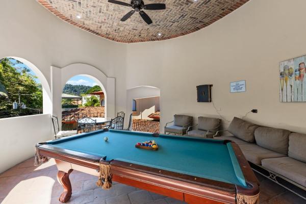Outdoor game room at South Beach Jaco, a Costa Rica villa rental with pool table and tropical setting