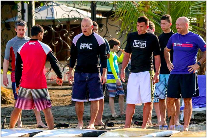 Surf lessons instructor with students