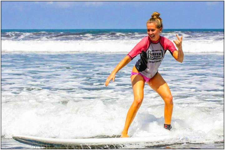 Girl taking surf lessons in Jaco Costa Rica