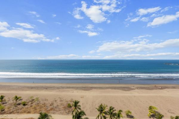 Aerial view of Jaco Beach and the Pacific Ocean from The Palms 1002 penthouse balcony