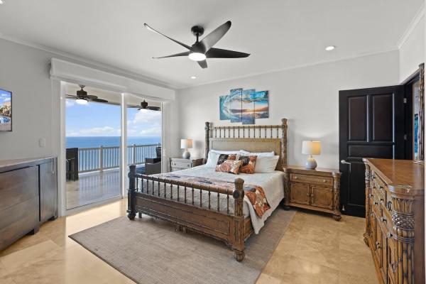 Master bedroom at The Palms 1002 with king bed and sliding doors to the ocean view balcony