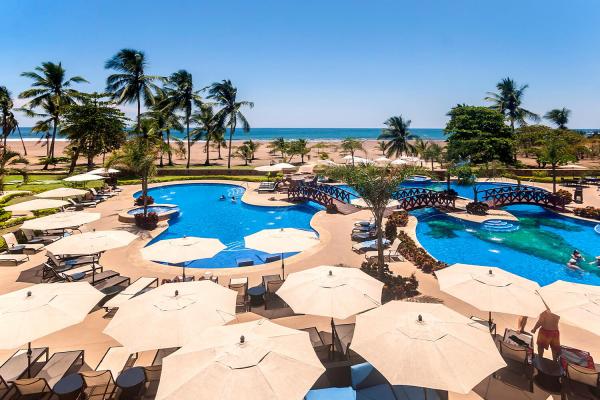 Resort Pools with sun umbrellas at Crocs Resort in Jaco Costa Rica