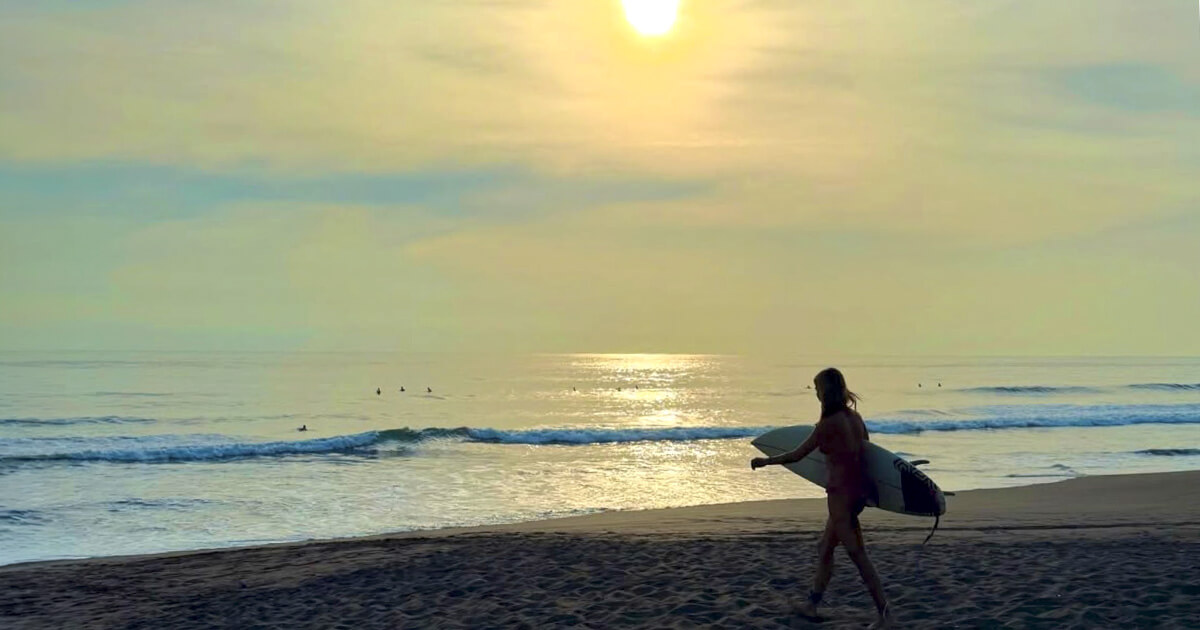 Dark sand beach at Playa Hermosa with powerful surf waves, Costa Rica