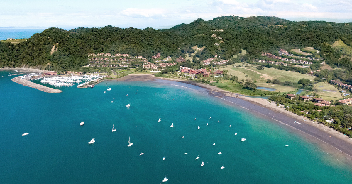 Calm bay at Playa Herradura with boats moored offshore and Los Sueños Marina, Costa Rica