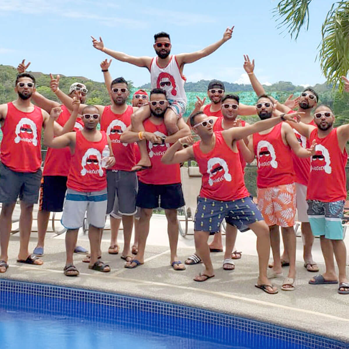 JacoVIP bachelor party group in front of vacation rental swimming pool in Jaco Costa Rica