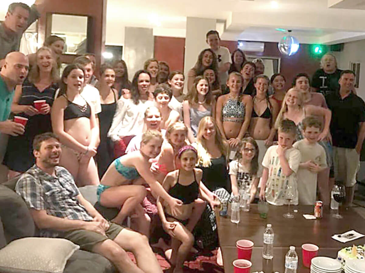 More than 20 family members gathered in the spacious living room of Rancho de Sueños vacation rental villa near Jaco Beach, Costa Rica, smiling and enjoying time together