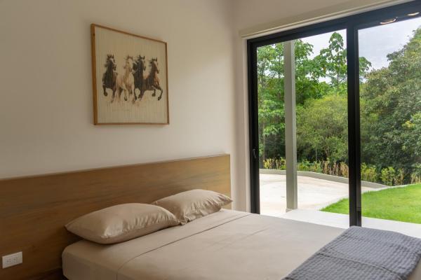 1 Queen Bed First floor bedroom 1 with queen bed and garden view