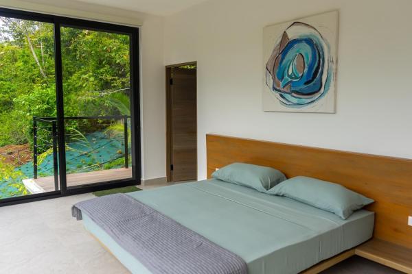 1 King Bed Second floor bedroom 7 with king bed and abstract artwork