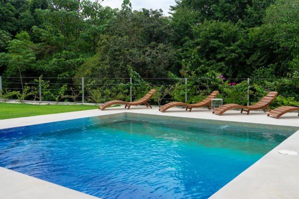 Villa Bugambilia pool surrounded by jungle in Playa Hermosa, Jaco
