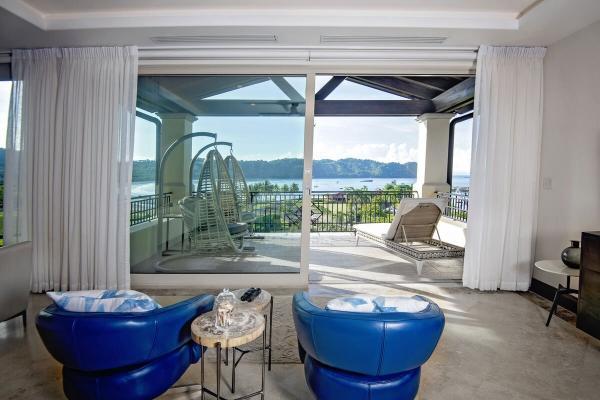 Second-floor living area with ocean view balcony at Villa Donostia