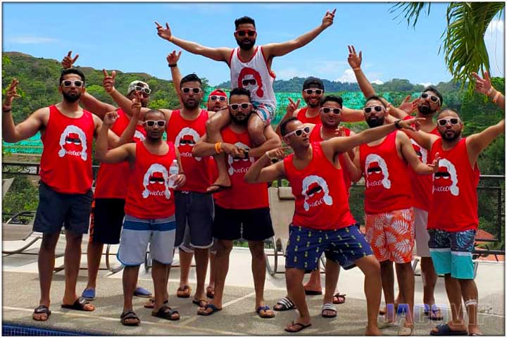 Group of guys with matching red shirts at bachelor party