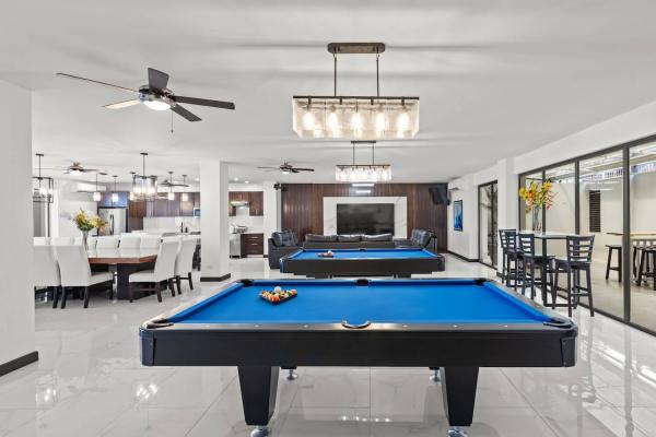 Pool table and large formal dining area side by side in the sweeping open-plan living space, Costa Rica