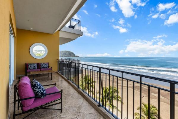 Main balcony at Vista Las Palmas facing south over Jaco Beach with ocean and horizon views