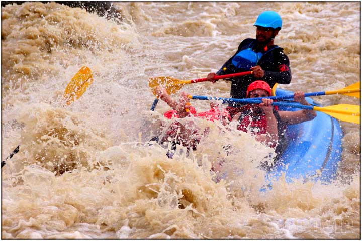 Large splash during river rafting tour
