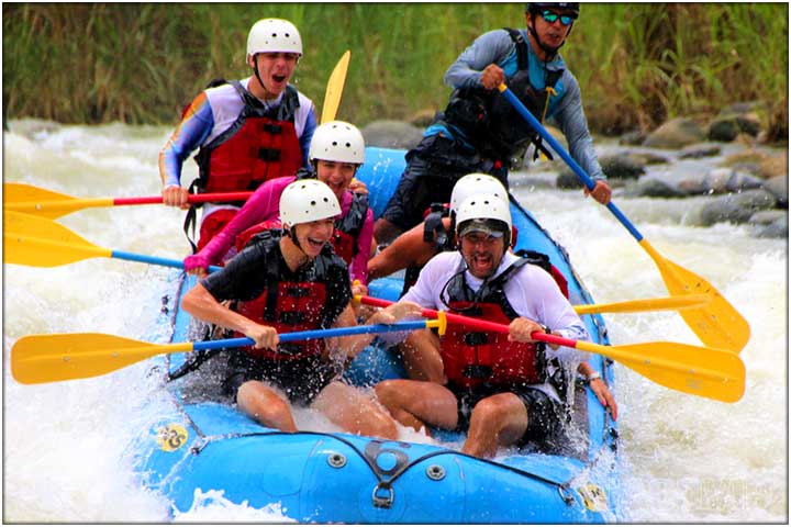 Blue raft and yellow paddles rafting