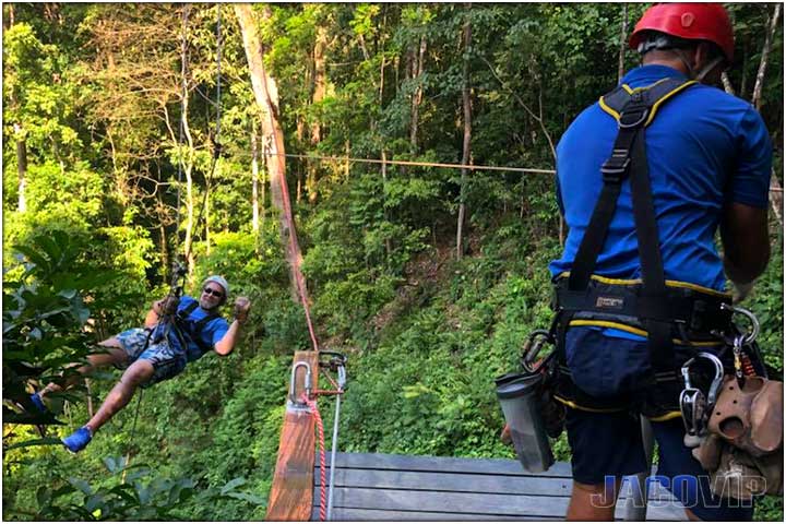 Tour guide and guest on first zipline in costa rica